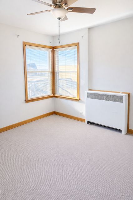 8400 South Honore Street, Unit 2 Chicago, IL 60620 - Photo 9 of 13 an empty room with a window