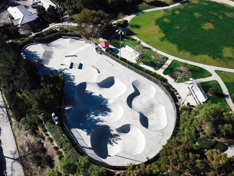 72 Downing Street Ladera Ranch, CA 92694 - Photo 14 of 14 a view of a swimming pool with a yard and outdoor seating