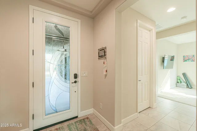 a view of kitchen with sink and refrigerator