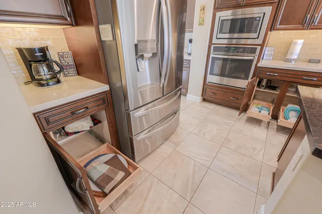 a bathroom with a tub shower and sink