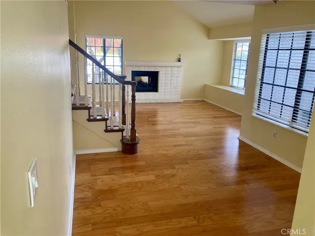 a view of an entryway with wooden floor