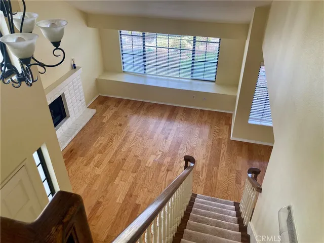 a bathroom with a toilet sink and window