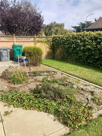 a wooden bench sitting in front of a building