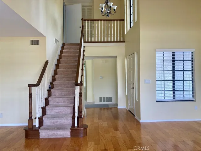 a view of an entryway with wooden floor