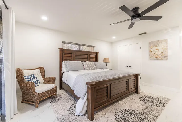 a bedroom with a bed and a couch