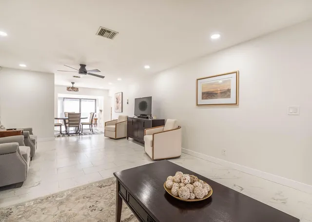 a living room with furniture and a table