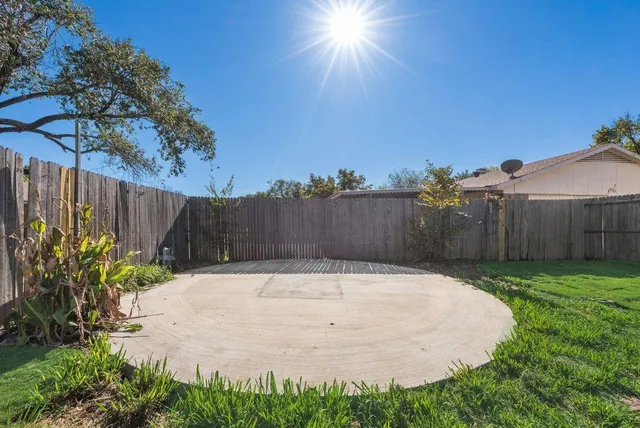 a swimming pool with wooden fence