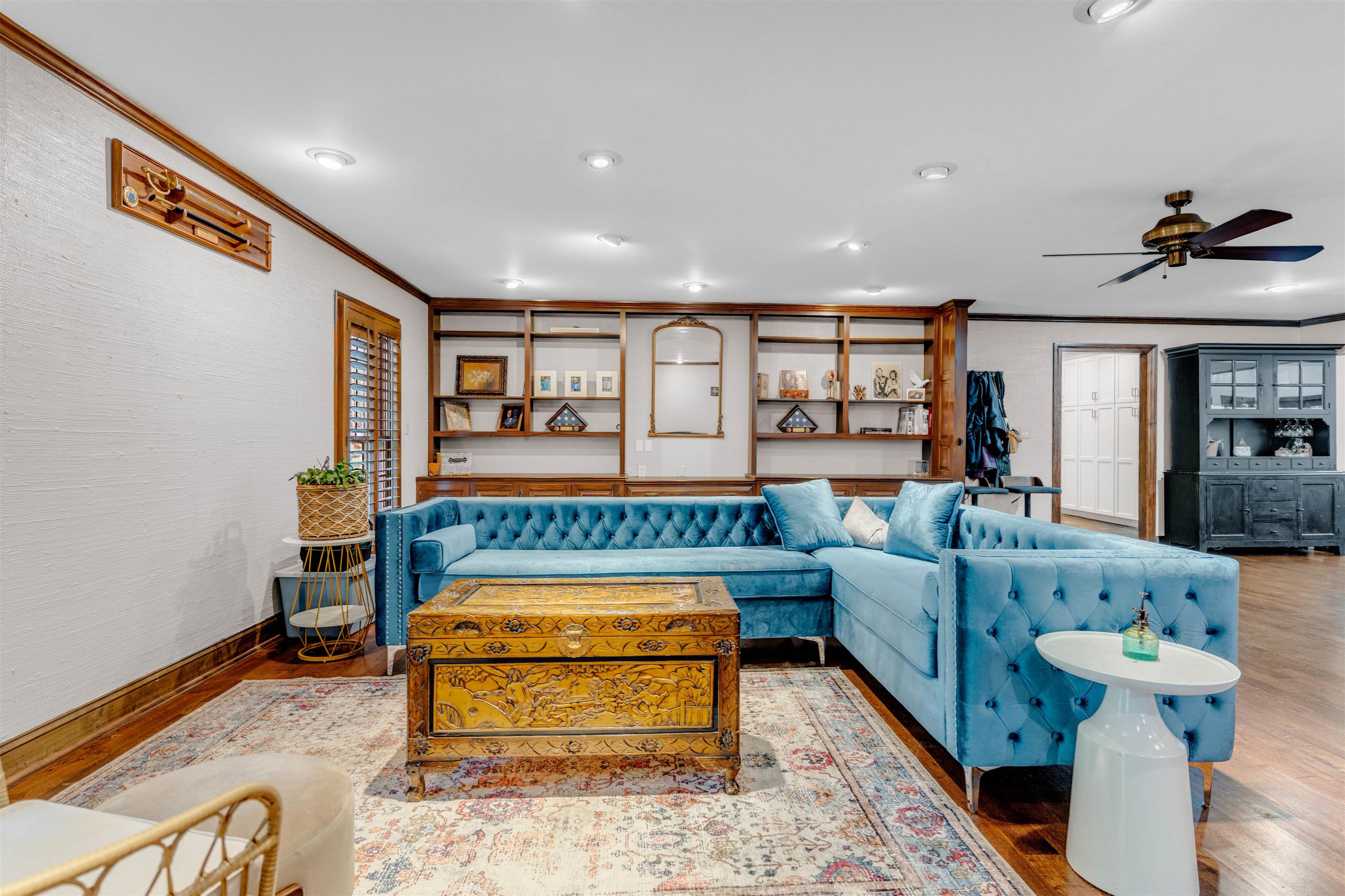 115 Westwood Cove Ripley, TN 38063 - Photo 13 of 40 a living room with furniture and a chandelier
