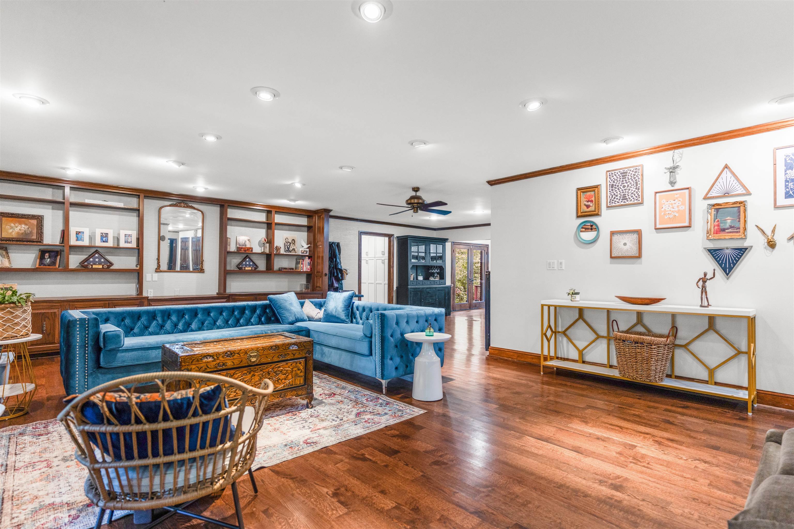 115 Westwood Cove Ripley, TN 38063 - Photo 14 of 40 a living room with furniture a dining table and chairs with wooden floor