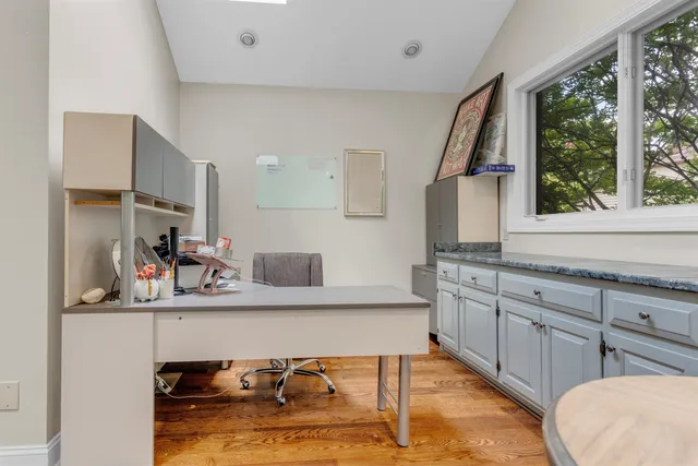 a room with two chair and window