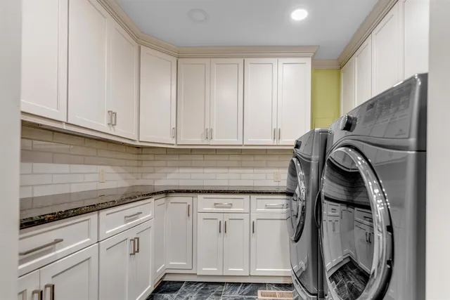 a utility room with cabinets