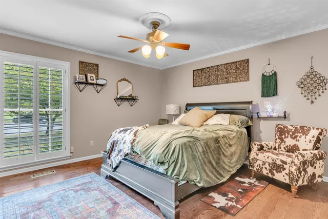 a bedroom with a bed and window