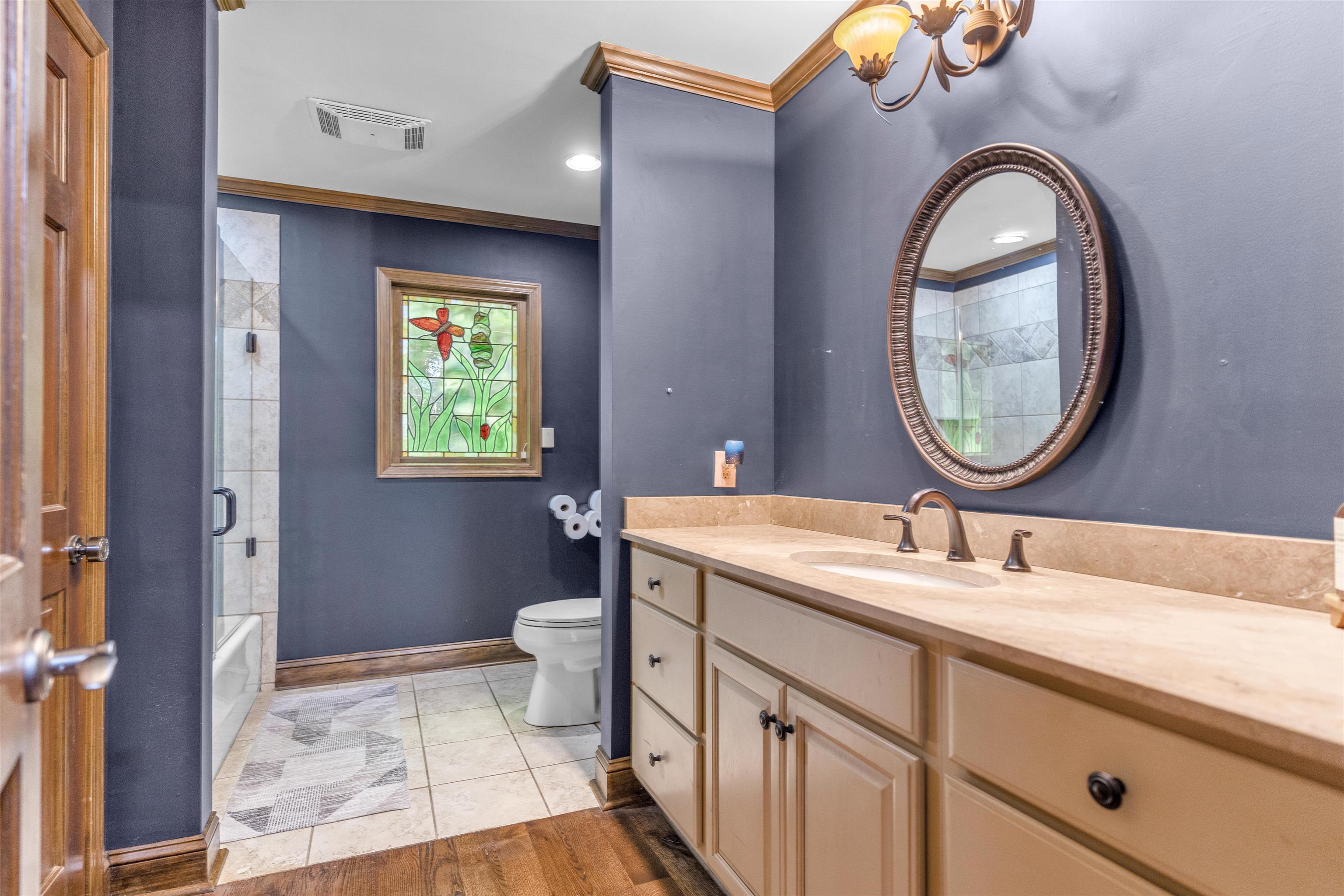 115 Westwood Cove Ripley, TN 38063 - Photo 22 of 40 a bathroom with a sink and a mirror