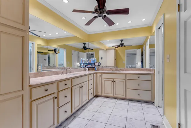 a spacious bathroom with a granite countertop sink mirror and