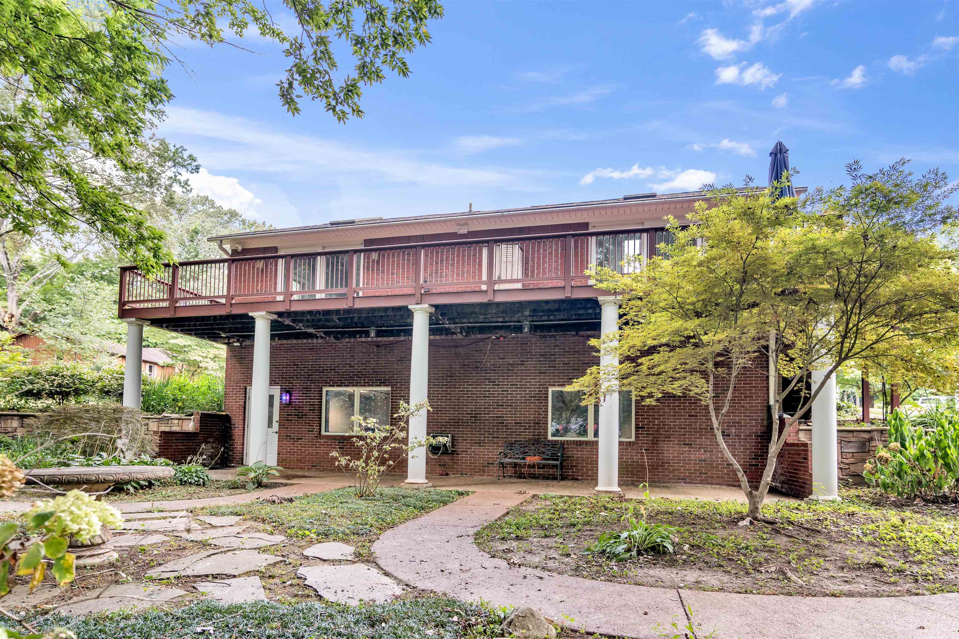 115 Westwood Cove Ripley, TN 38063 - Photo 28 of 40 a front view of a house with garden