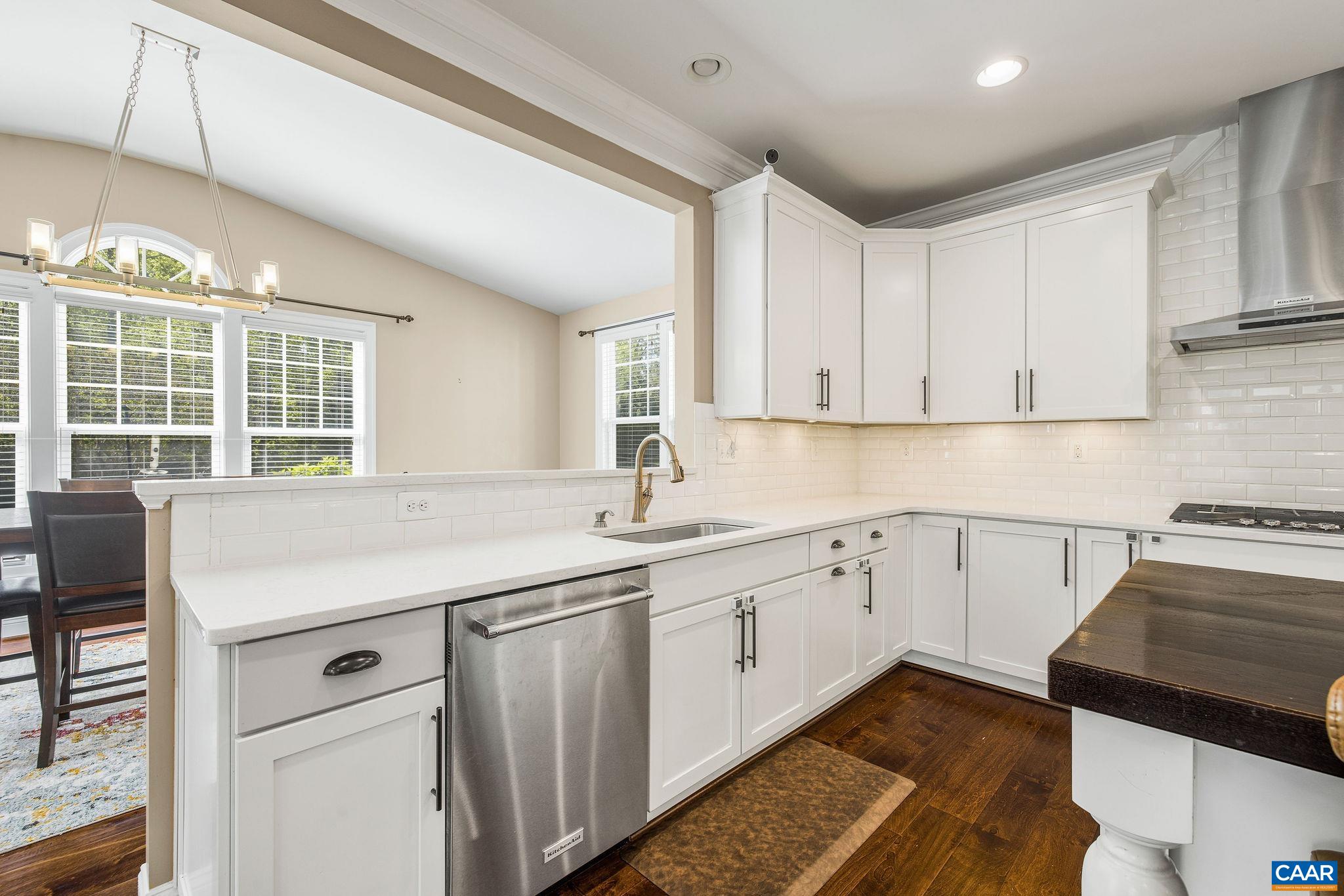 1630 Victor Place Charlottesville, VA 22903 - Photo 19 of 73 a kitchen with a sink stove and cabinets