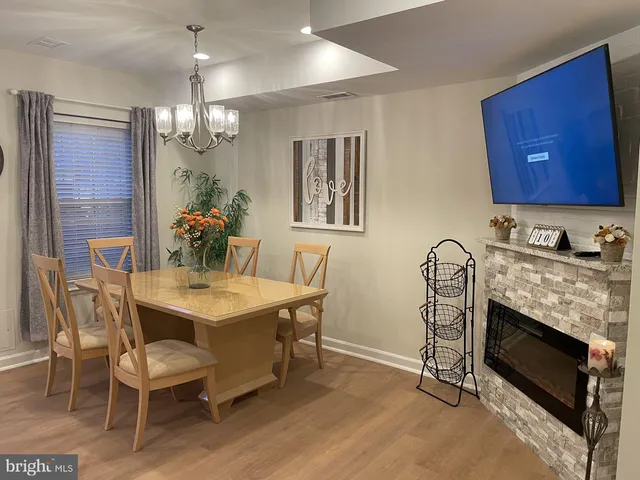 a kitchen with granite countertop a sink and a stove top oven