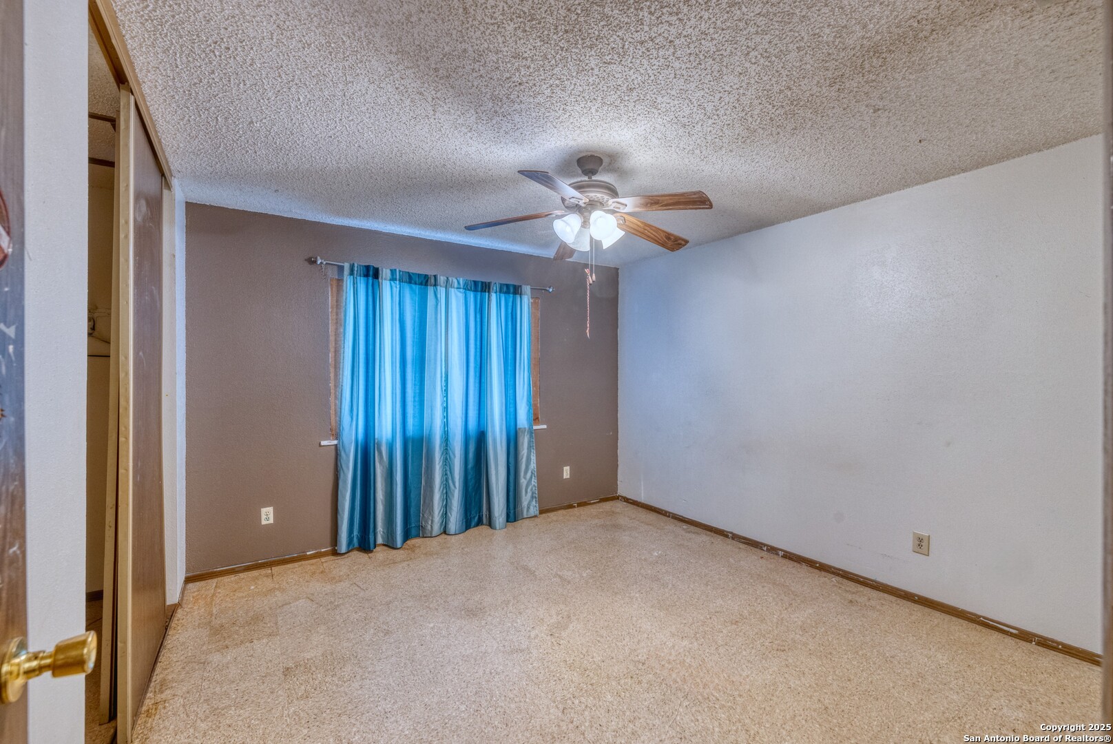 313 Bohme Street Uvalde, TX 78801 - Photo 12 of 23 a view of an empty room with a window