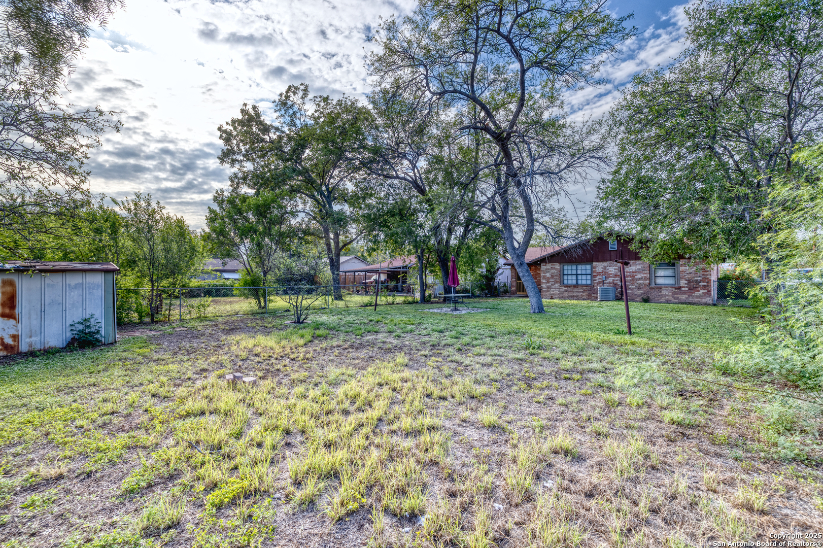 313 Bohme Street Uvalde, TX 78801 - Photo 15 of 23 a view of a backyard with a garden