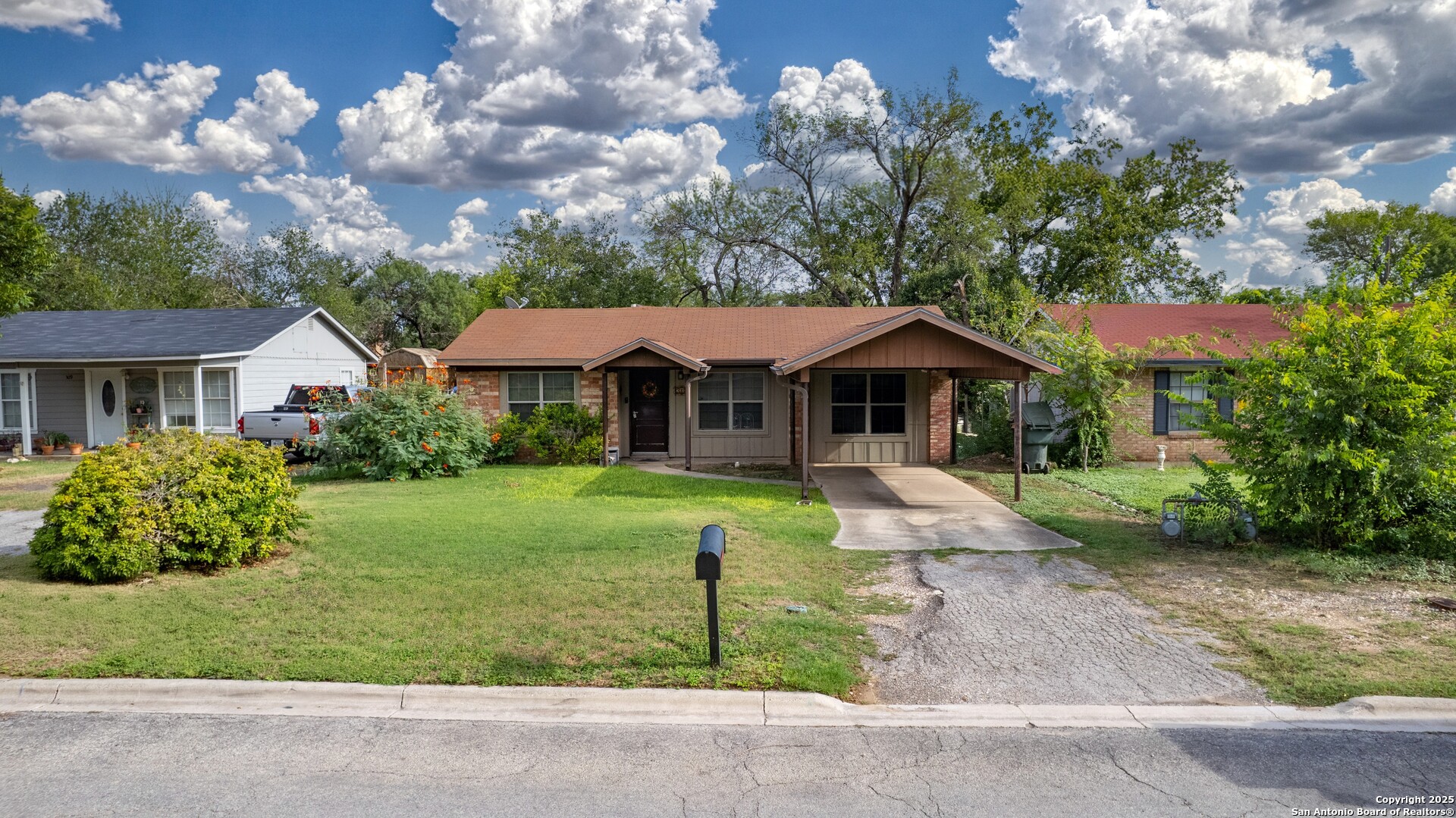 313 Bohme Street Uvalde, TX 78801 - Photo 18 of 23 a front view of a house with garden
