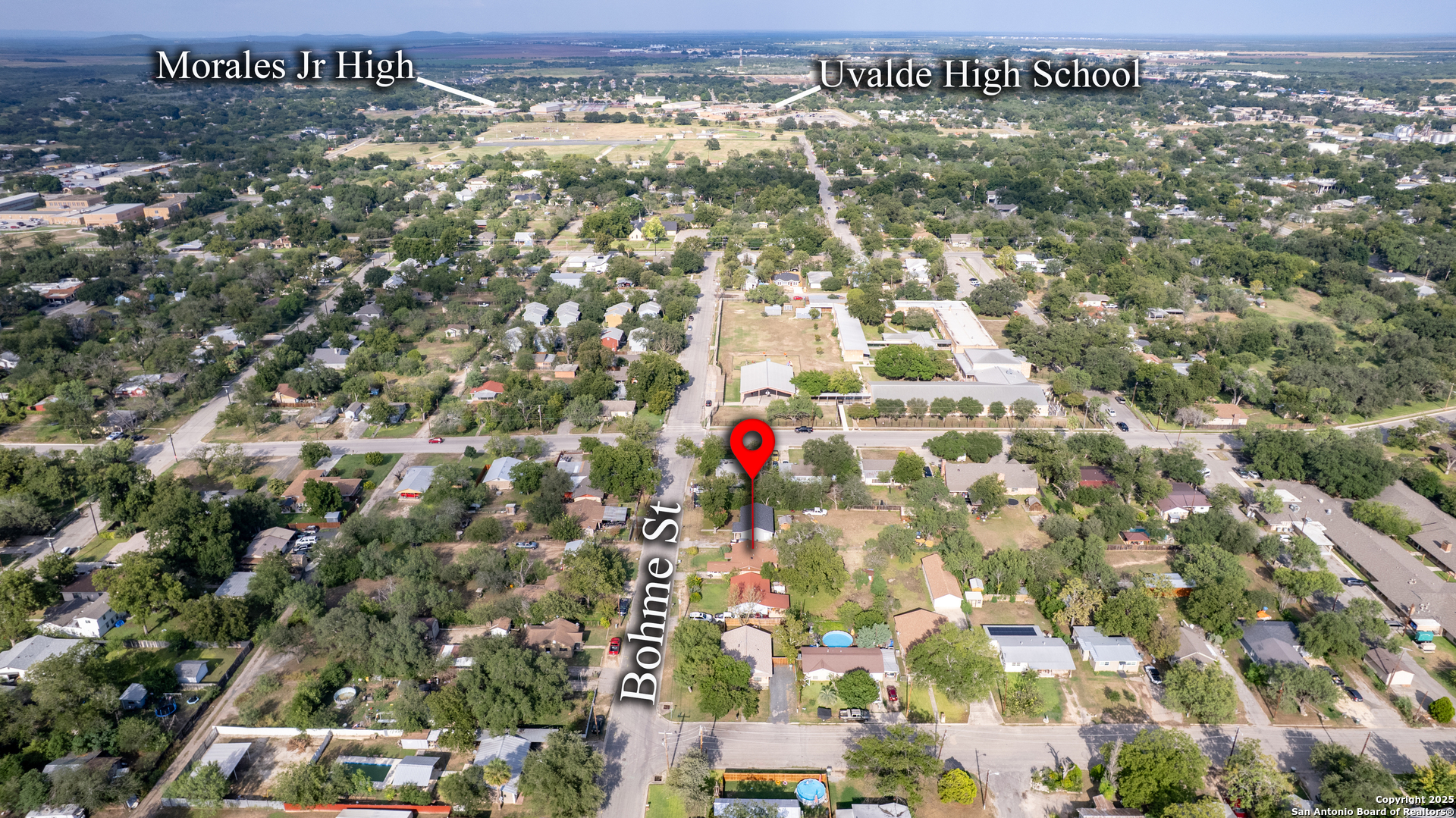 313 Bohme Street Uvalde, TX 78801 - Photo 20 of 23 an aerial view of residential building and parking space