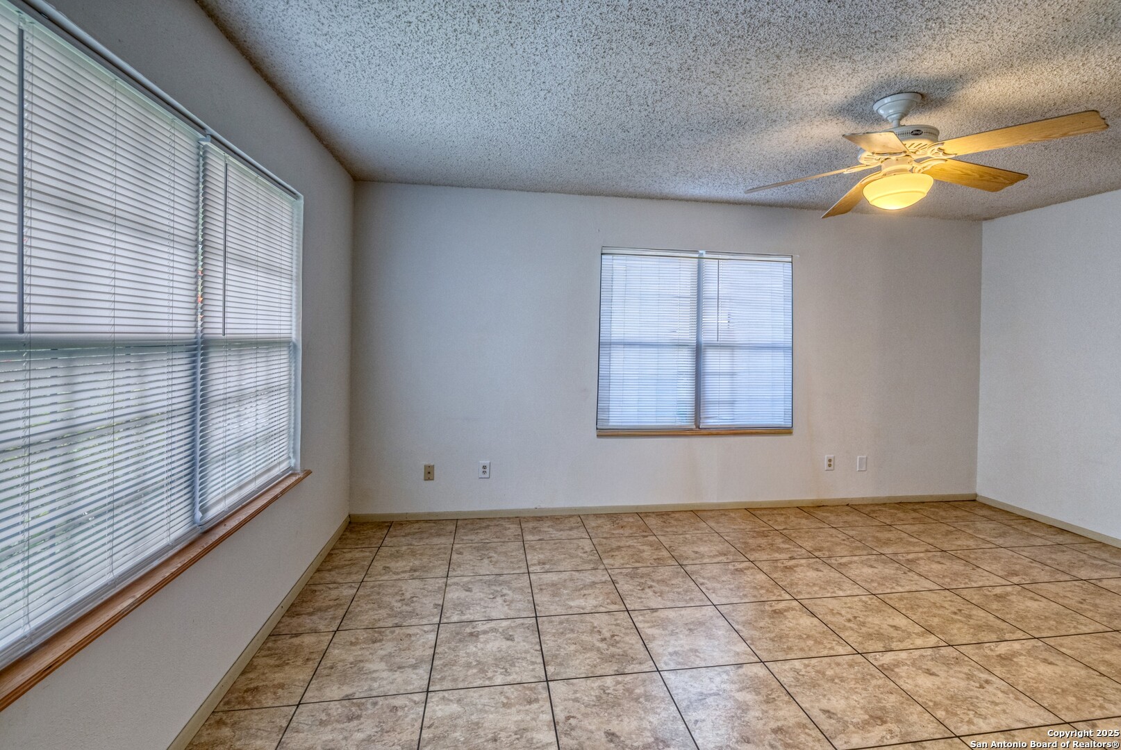 313 Bohme Street Uvalde, TX 78801 - Photo 4 of 23 a view of an empty room and window