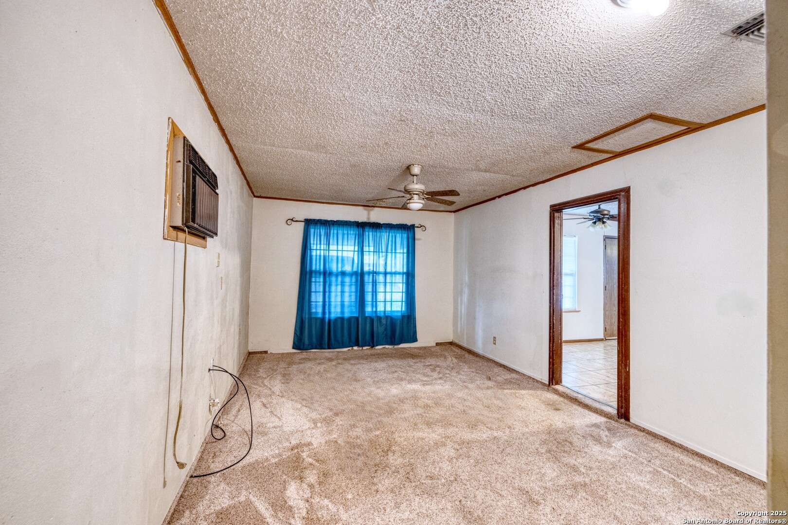 313 Bohme Street Uvalde, TX 78801 - Photo 9 of 23 a view of a livingroom with a staircase