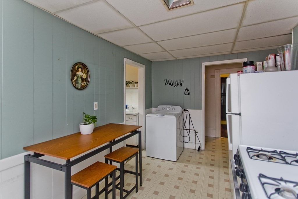 48-50 Howes Street Springfield, MA 01118 - Photo 20 of 38 a room with furniture and a chandelier