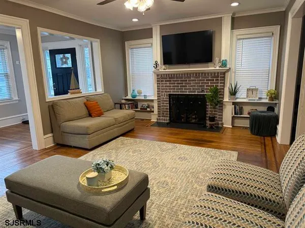 a living room with furniture and a fireplace
