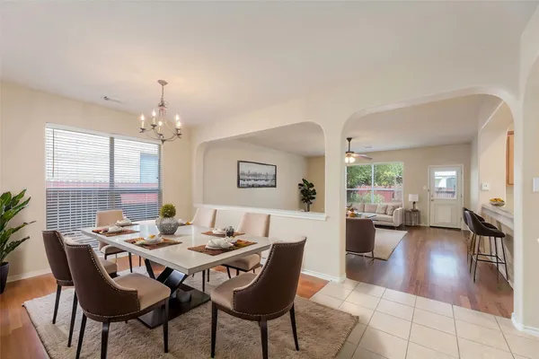 a view of a dining room with furniture window and wooden floor