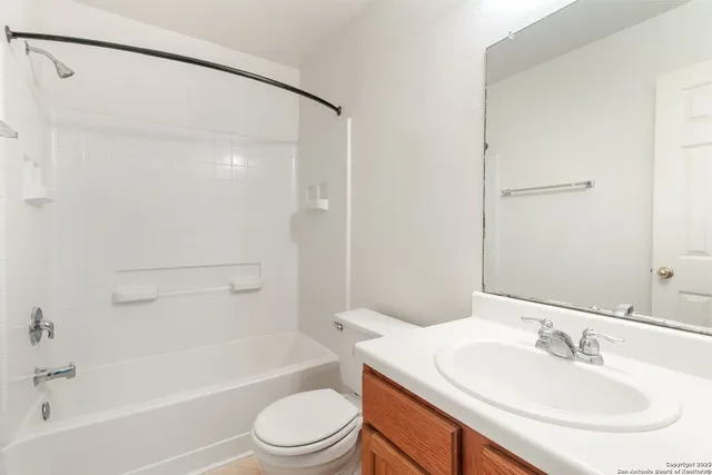 a bathroom with a sink toilet and a bathtub