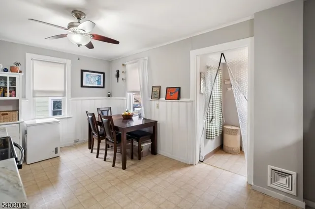a view of a livingroom with furniture and a dining table