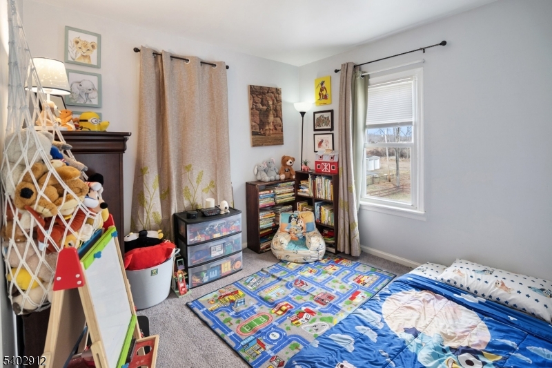 89 Trinity Street Newton, NJ 07860 - Photo 18 of 21 a bedroom with a bed and a window