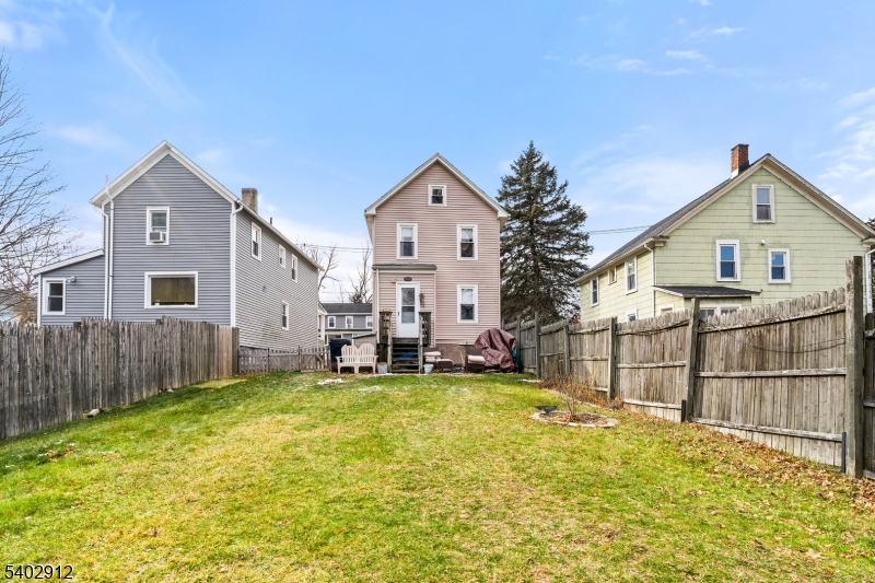 89 Trinity Street Newton, NJ 07860 - Photo 3 of 21 a view of a house with a yard and a large tree