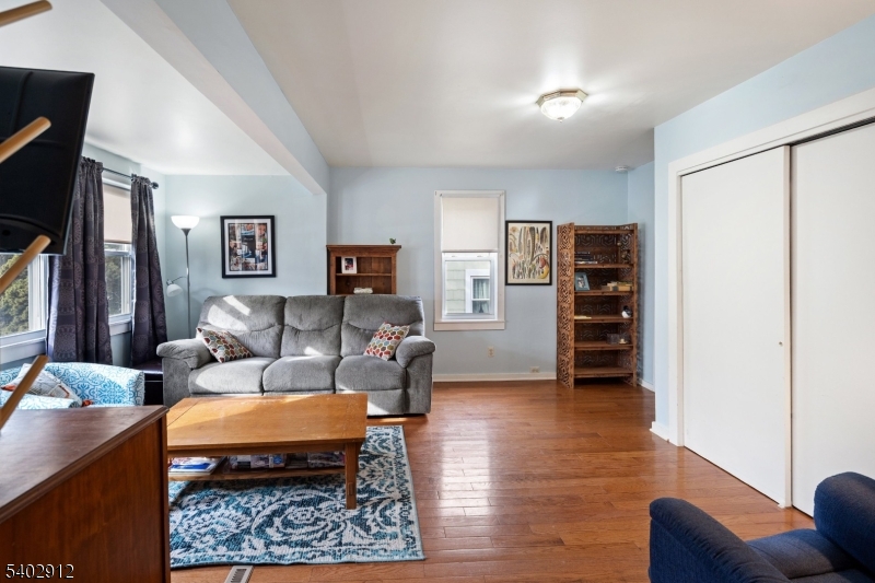 89 Trinity Street Newton, NJ 07860 - Photo 8 of 21 a living room with furniture and a flat screen tv