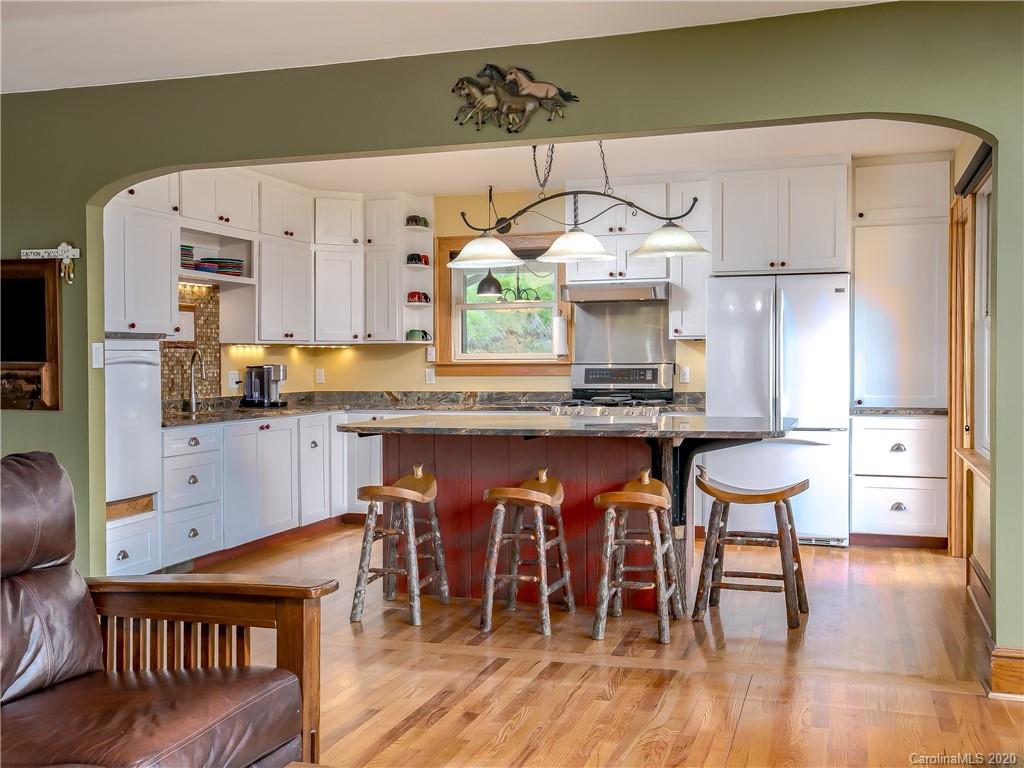 390 Grandview Road Canton, NC 28716 - Photo 11 of 42 a kitchen with stainless steel appliances granite countertop a refrigerator and a stove top oven