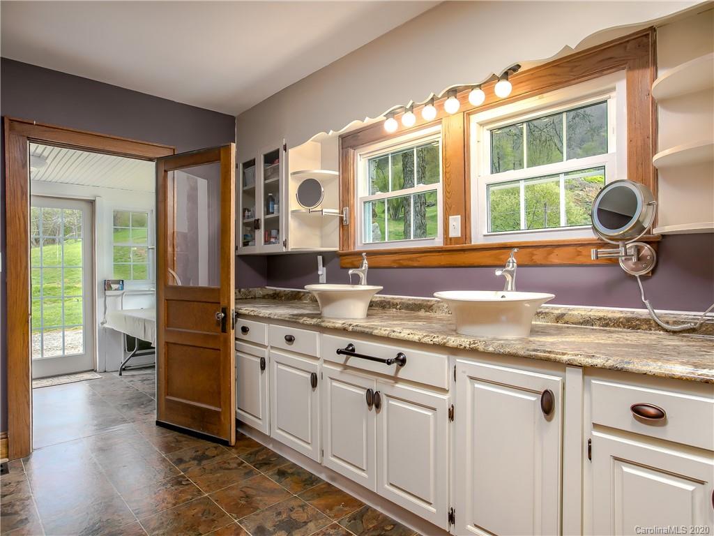 390 Grandview Road Canton, NC 28716 - Photo 20 of 42 a kitchen with stainless steel appliances granite countertop a stove and a sink