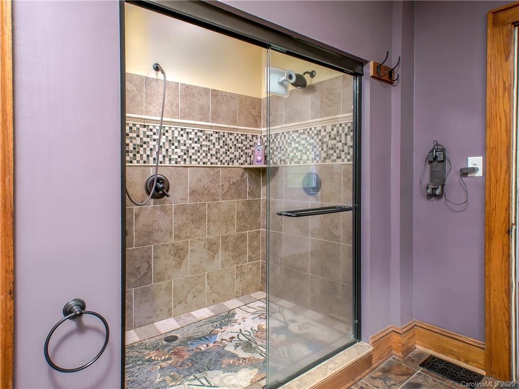 390 Grandview Road Canton, NC 28716 - Photo 21 of 42 a bathroom with a granite countertop shower