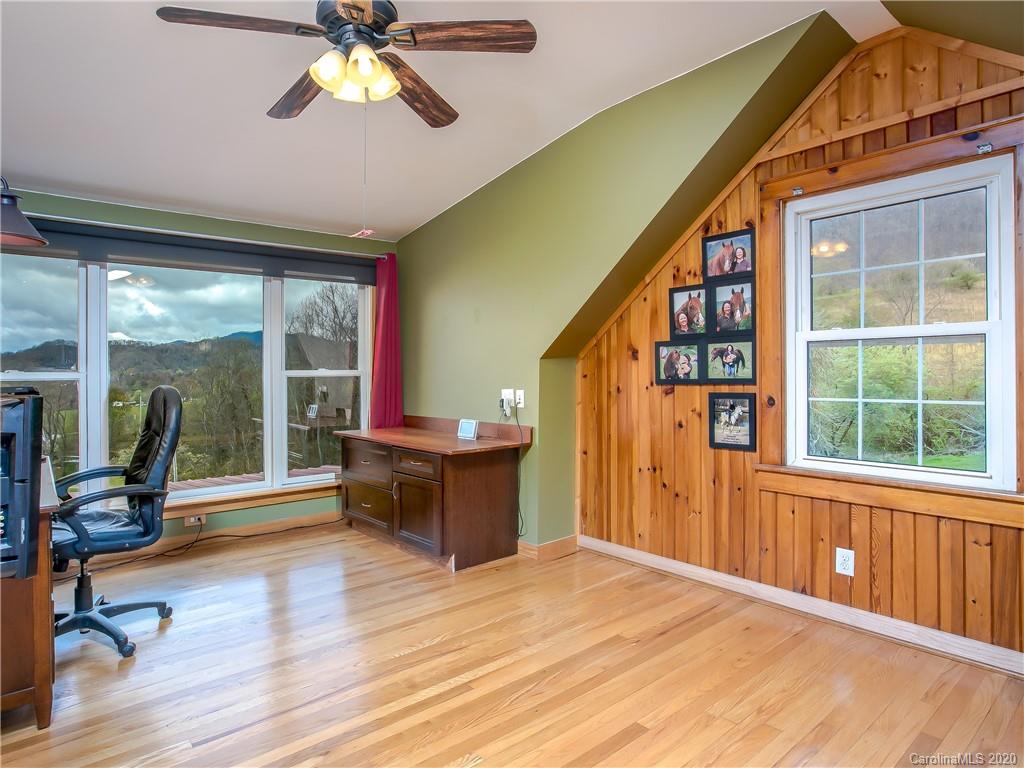 390 Grandview Road Canton, NC 28716 - Photo 25 of 42 a view of a bedroom with furniture window and wooden floor
