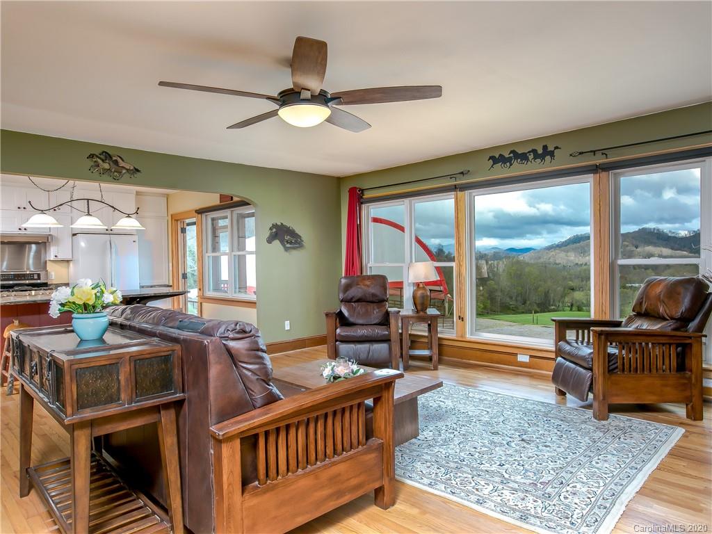 390 Grandview Road Canton, NC 28716 - Photo 8 of 42 a living room with furniture and a floor to ceiling window