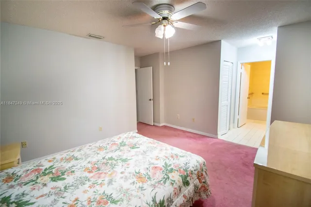 a white bath tub sitting next to a white sink