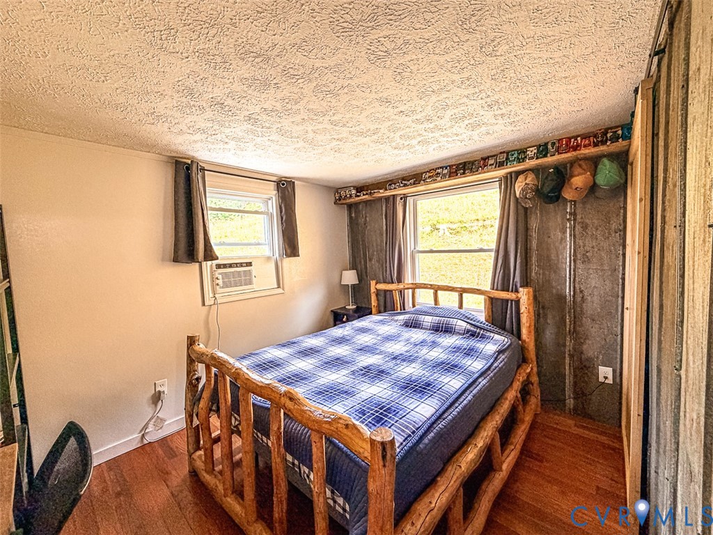 453 Long Hollow Road Cleveland, VA 24225 - Photo 18 of 50 a bed sitting in a bedroom next to a window