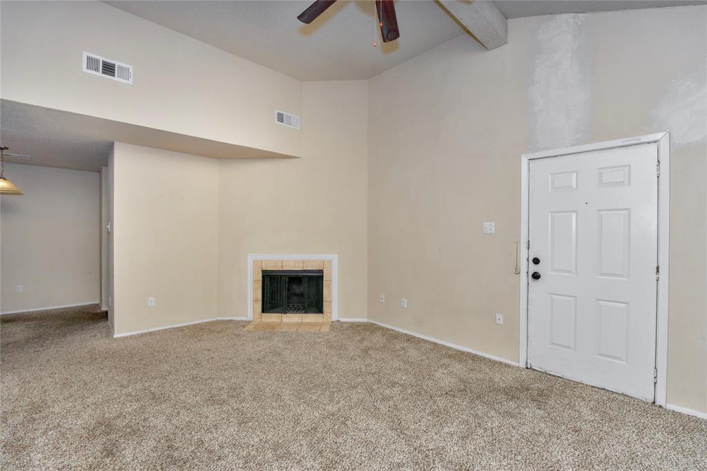 9696 Walnut Street, Unit 312 Dallas, TX 75243 - Photo 3 of 29 an empty room with closet and a ceiling fan