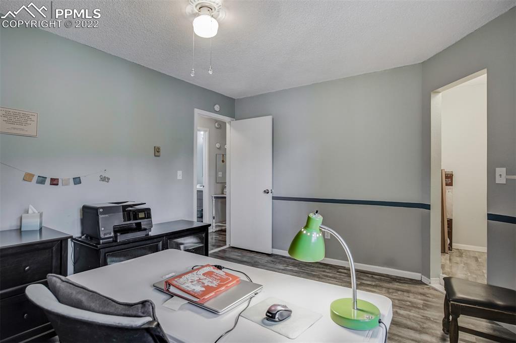 789 Alexander Road, Unit D Colorado Springs, CO 80909 - Photo 12 of 36 a living room with furniture