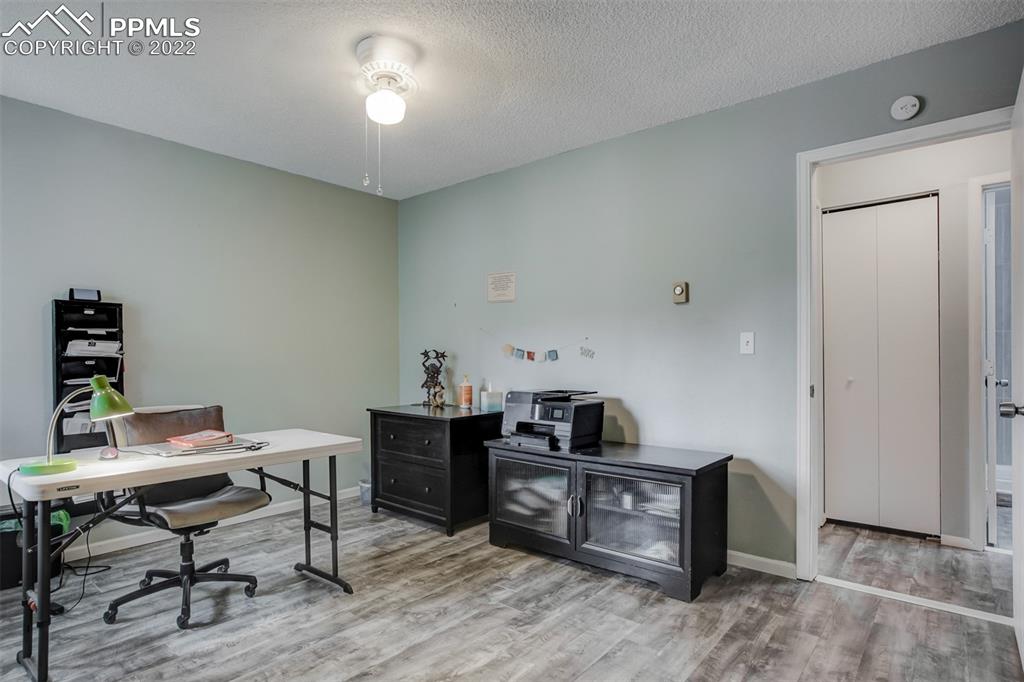 789 Alexander Road, Unit D Colorado Springs, CO 80909 - Photo 13 of 36 a view of a workspace with furniture