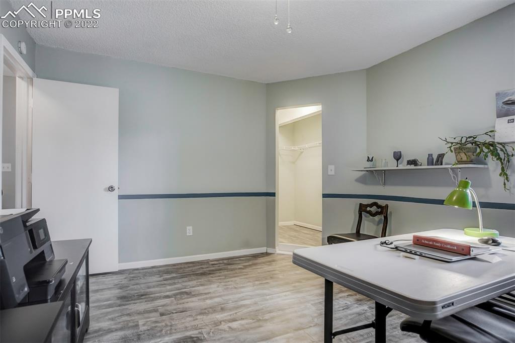 789 Alexander Road, Unit D Colorado Springs, CO 80909 - Photo 14 of 36 a workspace with furniture and window