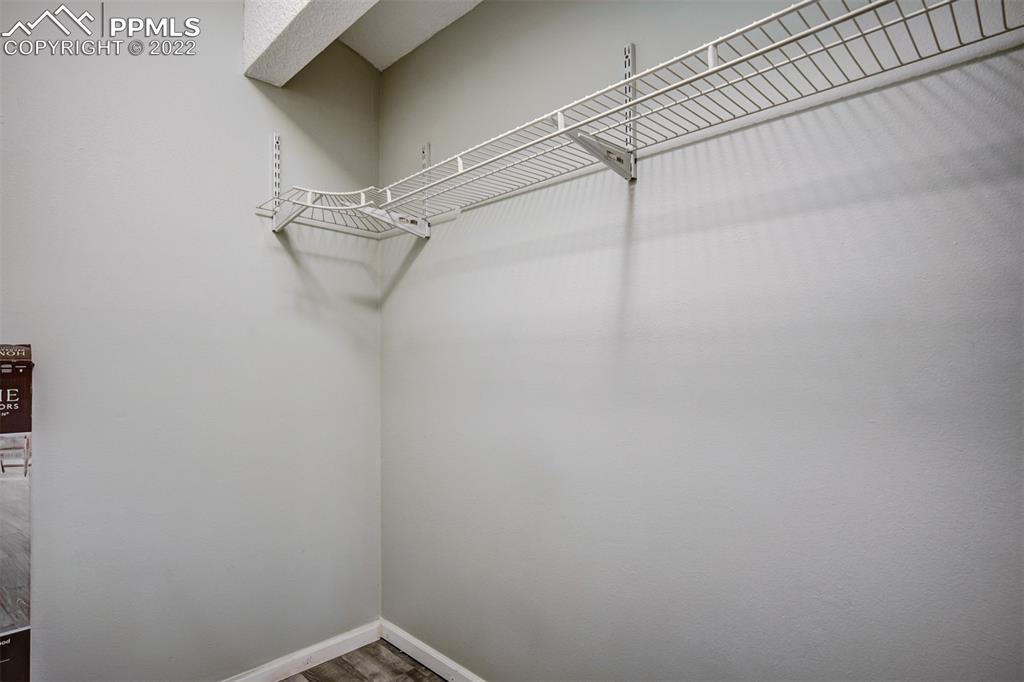 789 Alexander Road, Unit D Colorado Springs, CO 80909 - Photo 15 of 36 a view of a room with racks on the wall