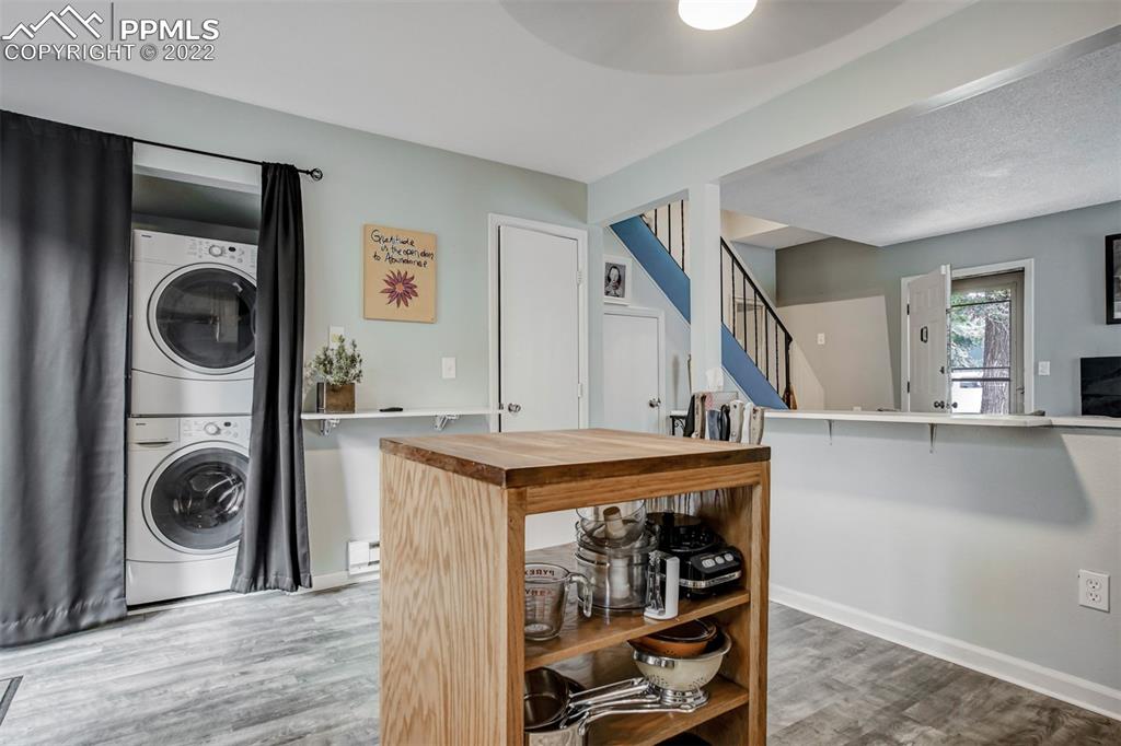 789 Alexander Road, Unit D Colorado Springs, CO 80909 - Photo 21 of 36 a view of a kitchen with washer and dryer