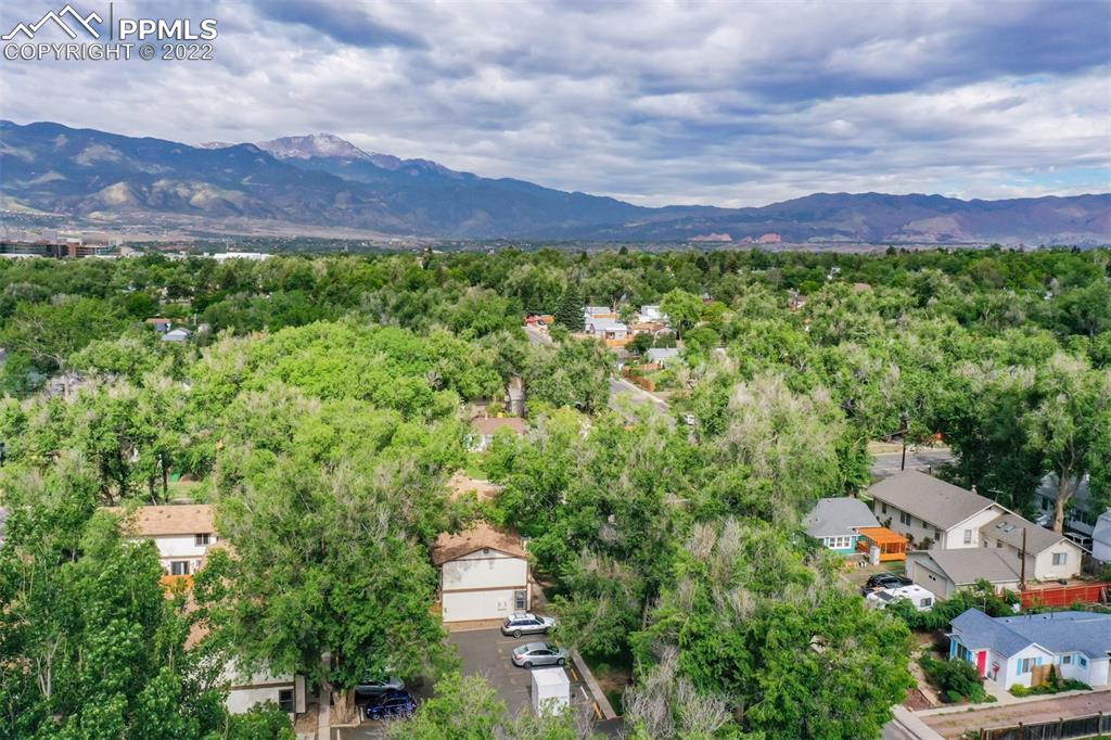 789 Alexander Road, Unit D Colorado Springs, CO 80909 - Photo 31 of 36 a view of a city with lush green forest