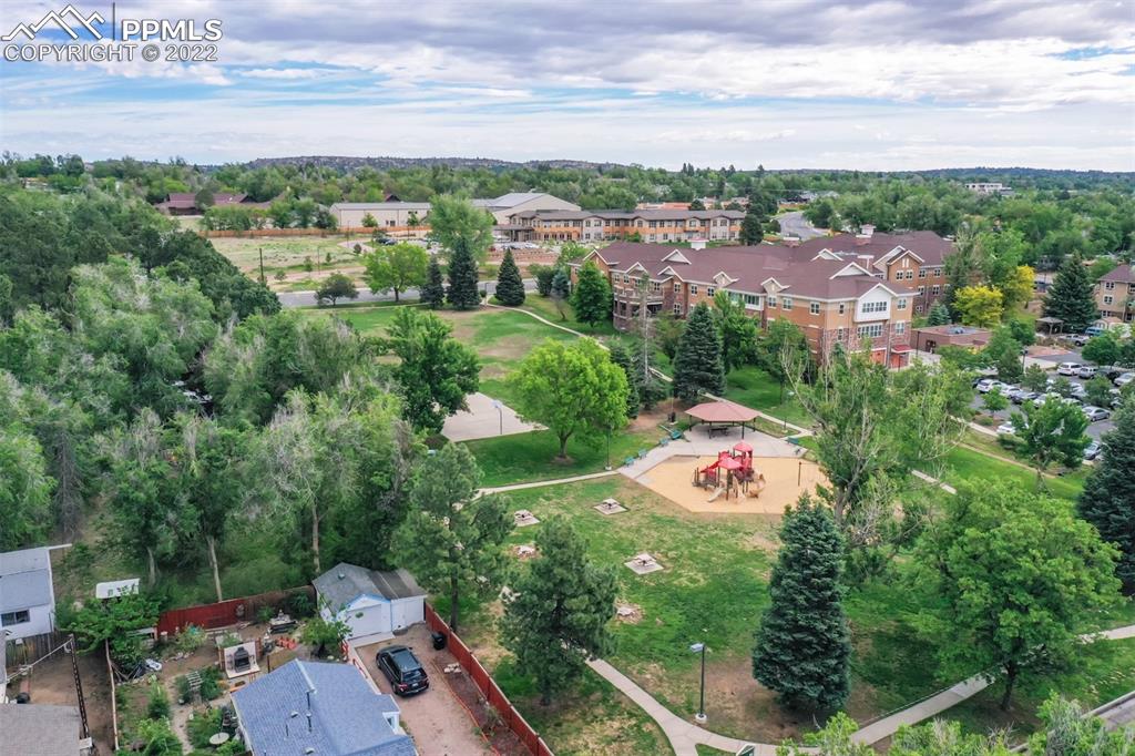 789 Alexander Road, Unit D Colorado Springs, CO 80909 - Photo 32 of 36 an aerial view of a golf course with parking space